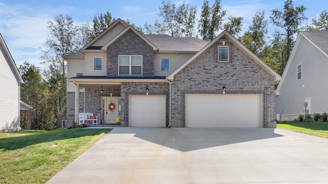 view of front of home featuring a front yard and a garage