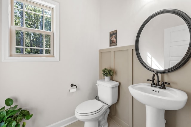 bathroom featuring sink and toilet