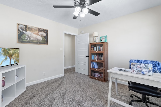 office space with carpet and ceiling fan