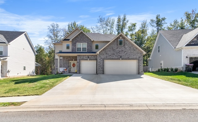 view of front of house featuring a front lawn and a garage