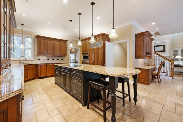 kitchen with ornamental molding, pendant lighting, decorative backsplash, and a large island