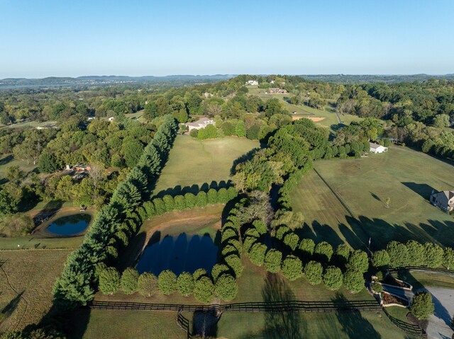 aerial view with a rural view and a water view