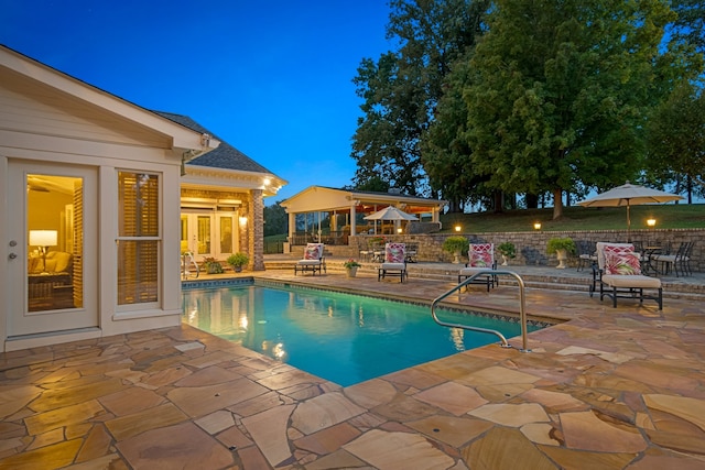 view of swimming pool with a patio