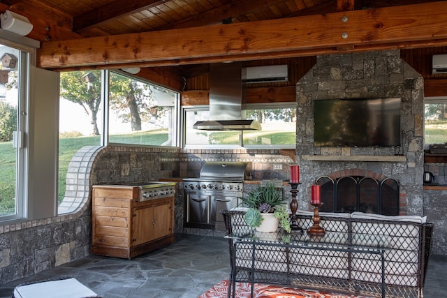 view of patio with an AC wall unit and area for grilling