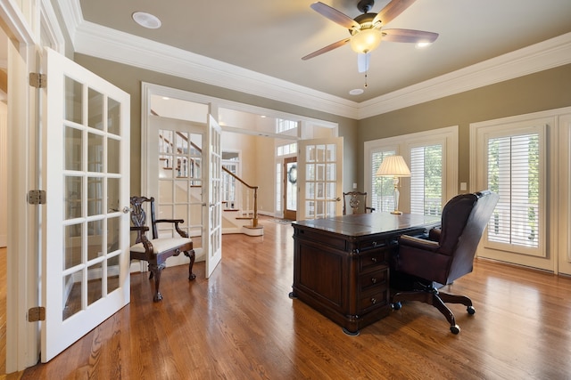 office space with french doors, hardwood / wood-style flooring, crown molding, and ceiling fan