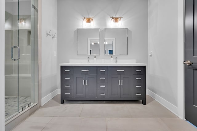 bathroom featuring an enclosed shower, tile patterned floors, and vanity