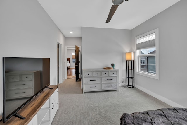 carpeted bedroom with ceiling fan