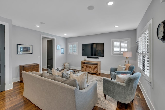 living room with dark hardwood / wood-style flooring