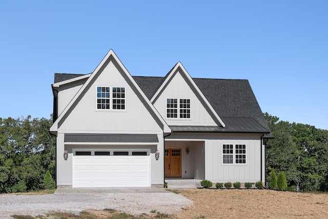 modern inspired farmhouse with covered porch and a garage