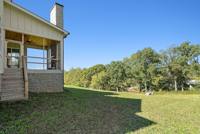 view of yard featuring ceiling fan