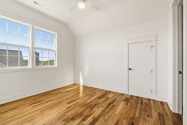 interior space featuring lofted ceiling, hardwood / wood-style flooring, and ceiling fan