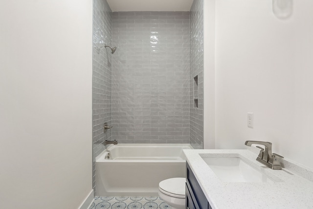 full bathroom featuring tiled shower / bath, tile patterned floors, vanity, and toilet