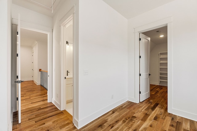 hallway featuring hardwood / wood-style flooring