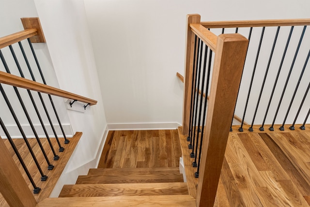 staircase featuring hardwood / wood-style floors