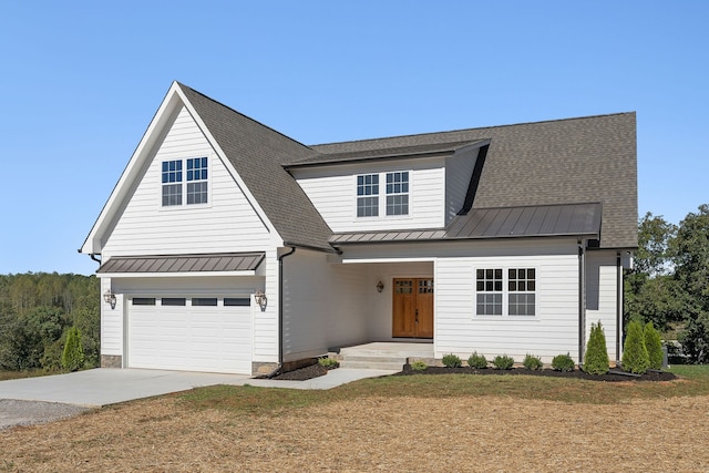 modern inspired farmhouse with a front lawn and covered porch