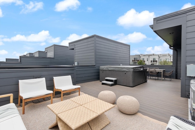 wooden terrace with a hot tub