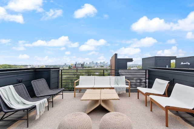 view of patio featuring outdoor lounge area and a balcony