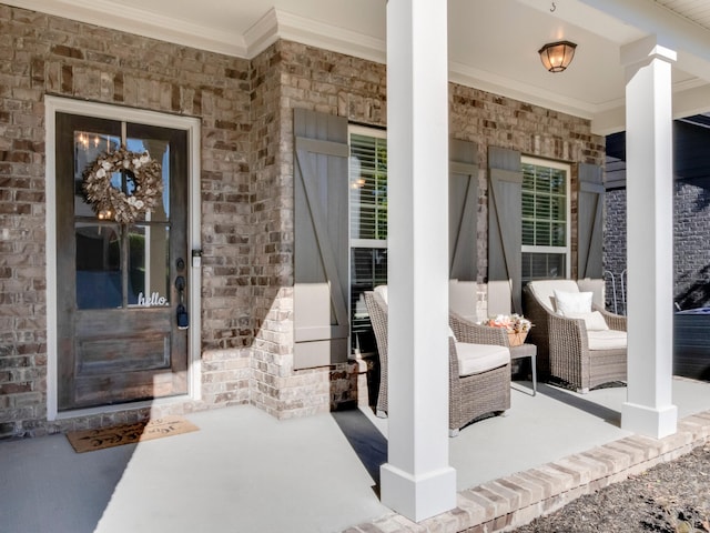 entrance to property featuring covered porch