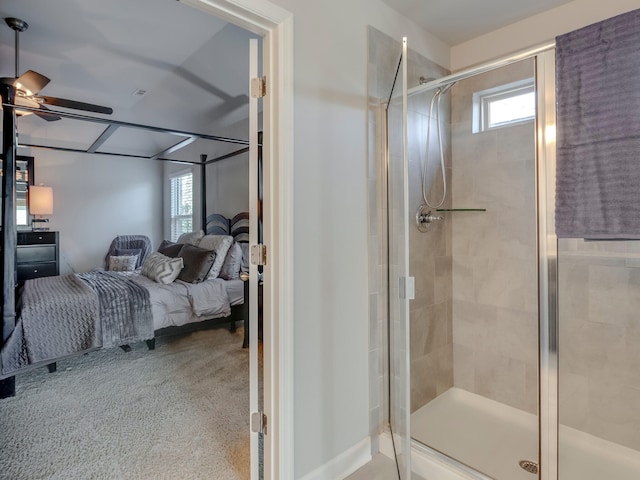 bathroom with ceiling fan and an enclosed shower