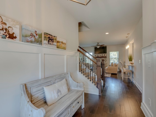 interior space featuring ceiling fan and dark hardwood / wood-style flooring