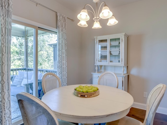 dining room featuring a chandelier and dark hardwood / wood-style flooring