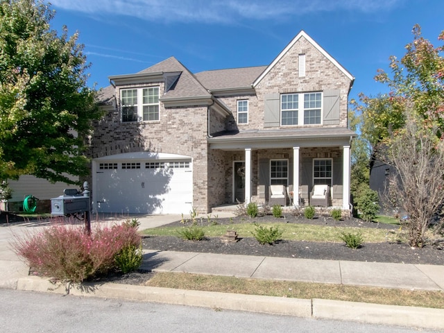 view of front of home featuring a garage and covered porch