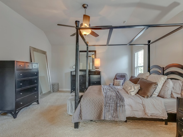 carpeted bedroom featuring lofted ceiling and ceiling fan