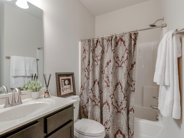 full bathroom featuring shower / bath combination with curtain, vanity, and toilet