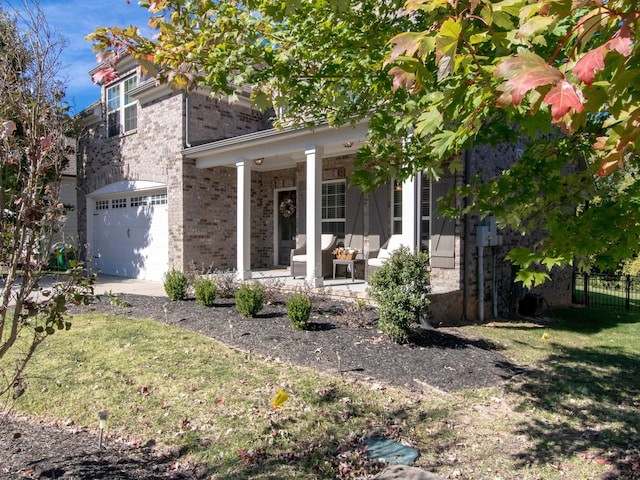 view of front of house with a front yard and a garage