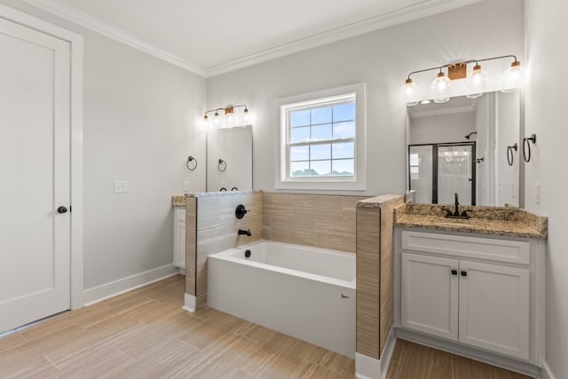 bathroom with ornamental molding, vanity, and independent shower and bath