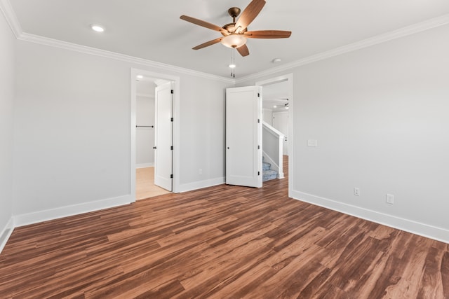 unfurnished bedroom with ornamental molding, ceiling fan, and dark hardwood / wood-style flooring