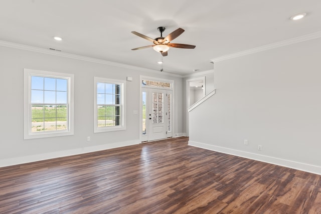 empty room with dark hardwood / wood-style floors, ornamental molding, and ceiling fan