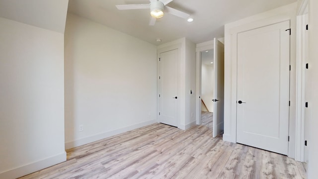 unfurnished bedroom featuring ceiling fan and light hardwood / wood-style flooring