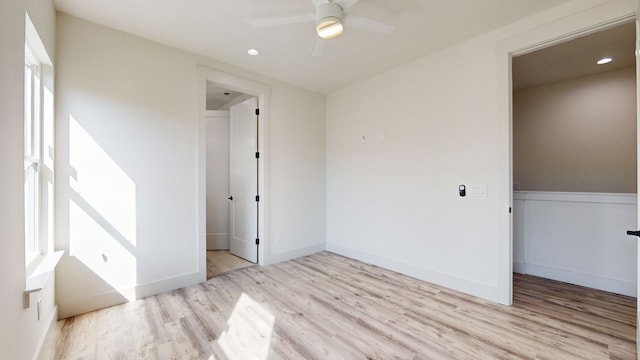 unfurnished bedroom featuring recessed lighting, a closet, baseboards, and wood finished floors