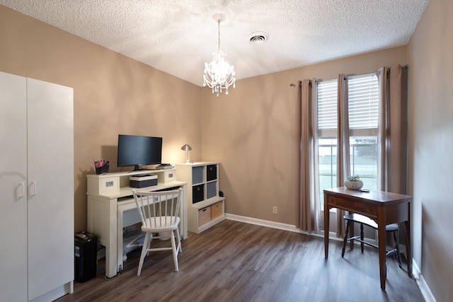 office featuring dark wood-type flooring, a chandelier, and a textured ceiling