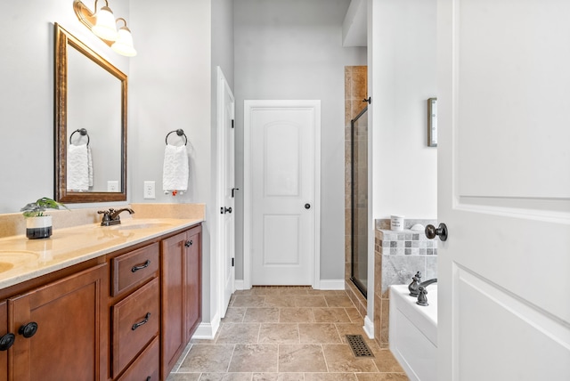 bathroom with vanity and separate shower and tub