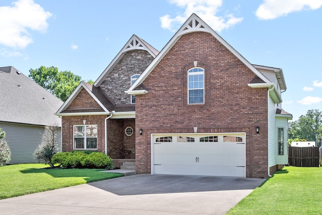 view of front of property with a front yard and a garage