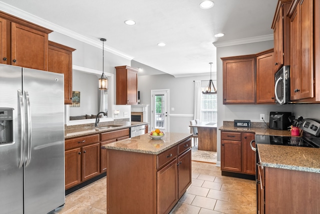 kitchen with stainless steel appliances, crown molding, decorative light fixtures, and sink