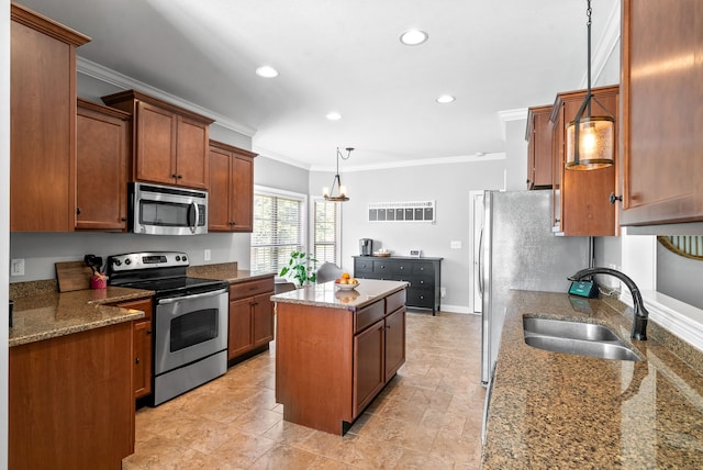 kitchen featuring a center island, sink, appliances with stainless steel finishes, stone countertops, and decorative light fixtures