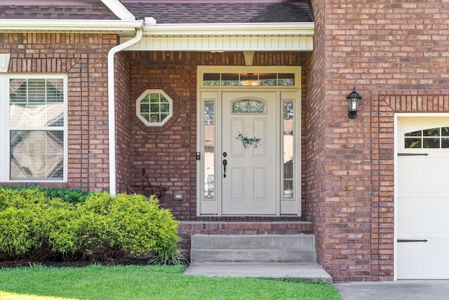 property entrance with a garage