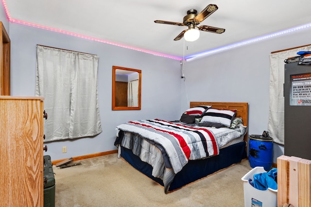 carpeted bedroom with ceiling fan