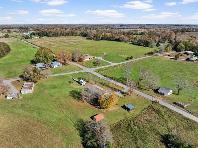 birds eye view of property with a rural view