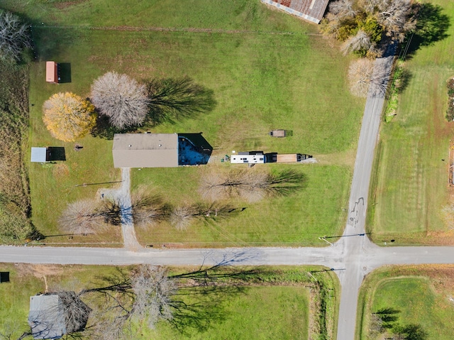 birds eye view of property with a rural view