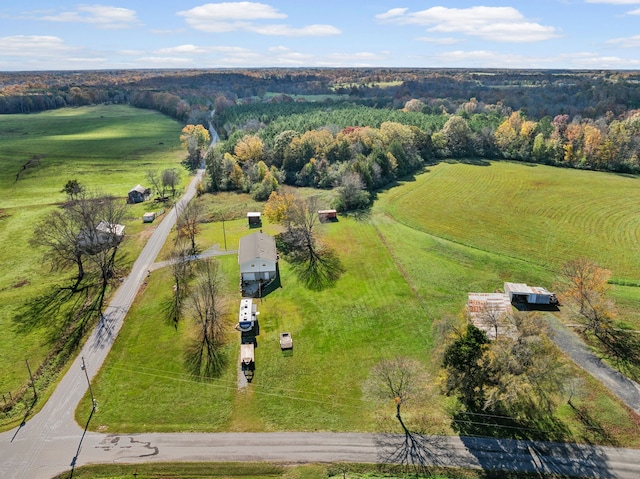 birds eye view of property with a rural view