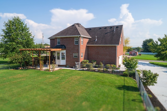 rear view of property with a patio area and a lawn