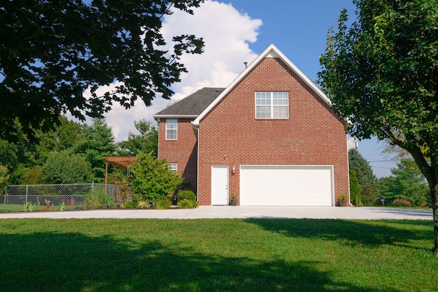 view of side of property with a garage, a pergola, and a lawn