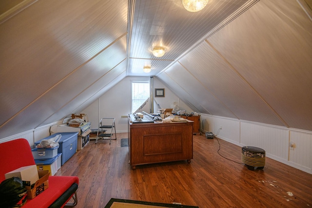 home office with lofted ceiling and dark hardwood / wood-style flooring