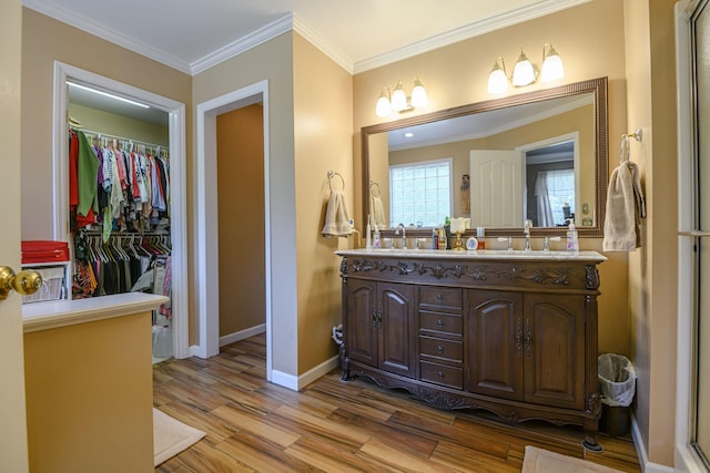 bathroom with vanity, wood-type flooring, and ornamental molding