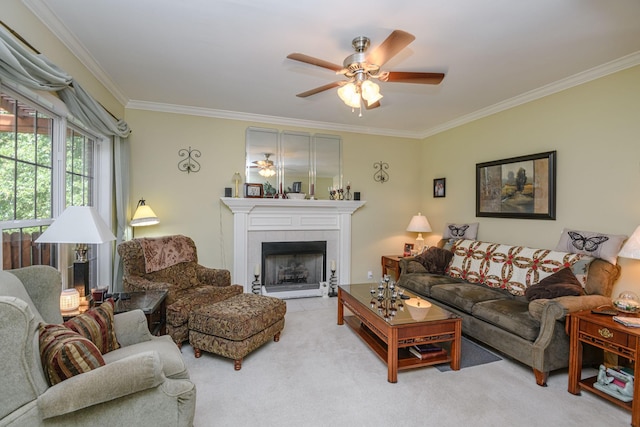 living room with light carpet, a tiled fireplace, ornamental molding, and ceiling fan