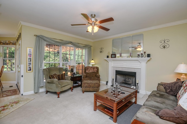 carpeted living room with ornamental molding, a tile fireplace, and ceiling fan